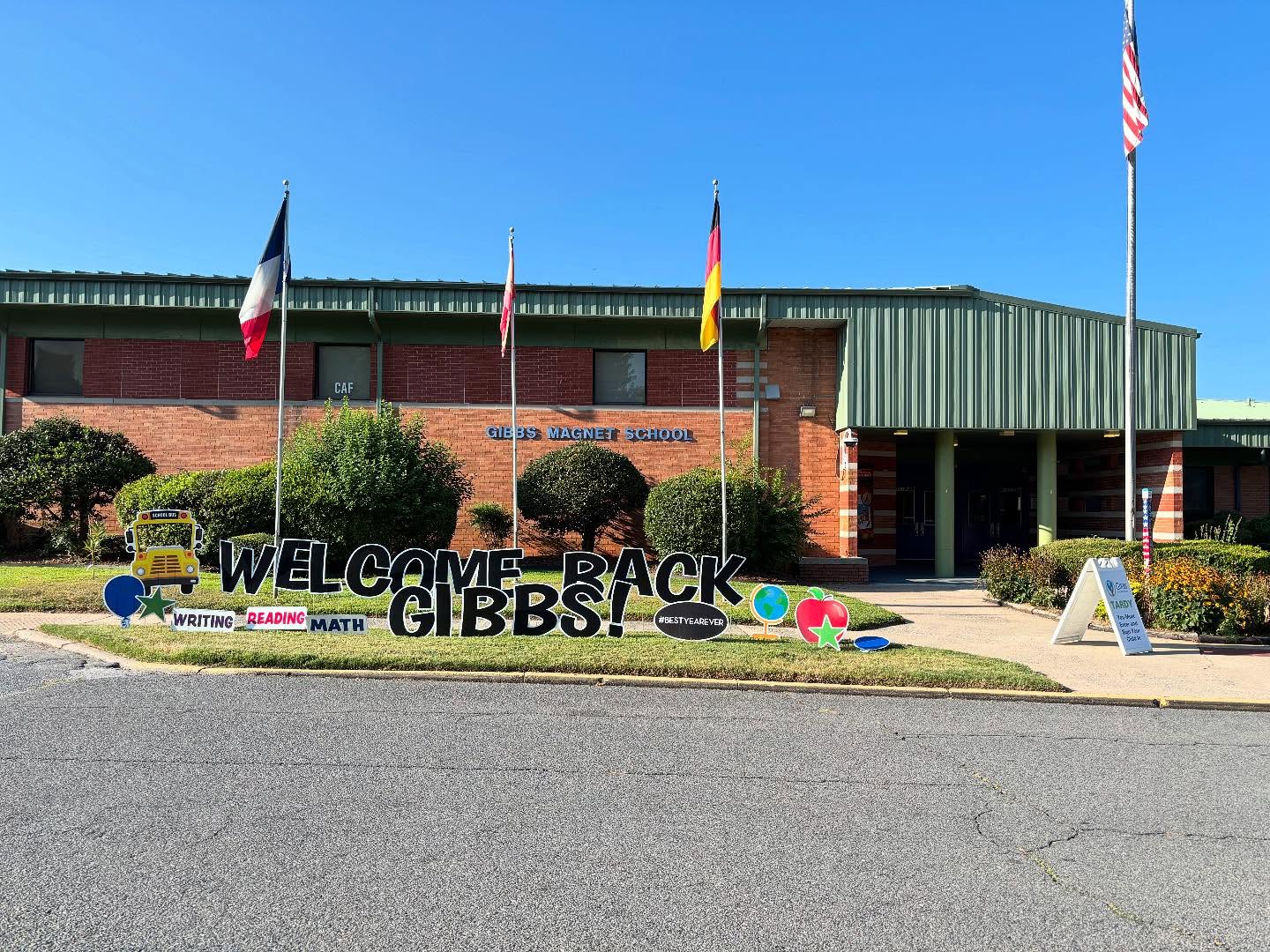 Welcome Back Gibbs! yard-sign display in front of Gibbs Magnet School.